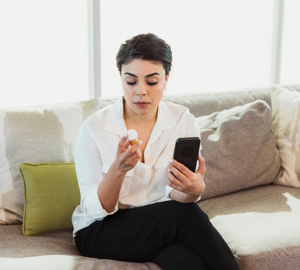 Pharmacist answering a question for a patient